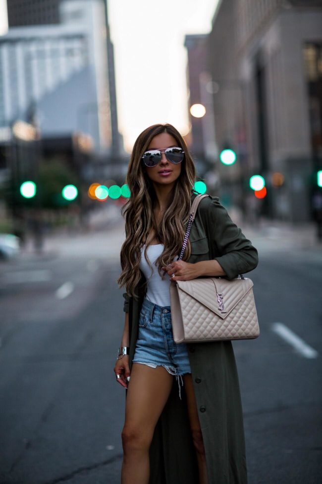 fashion blogger mia mia mine wearing a silver cuff bracelet and quay sunglasses 