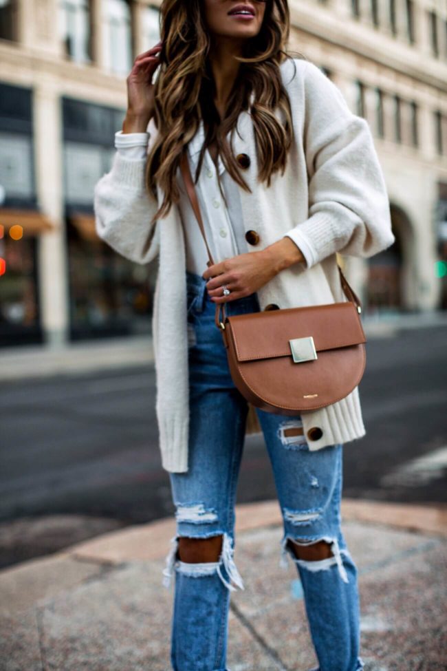fashion blogger mia mia mine wearing a demellier bag and grlfrnd denim