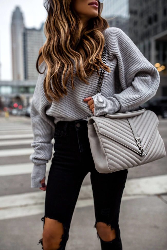 fashion blogger mia mia mine wearing a gray saint laurent college bag and a gray off-the-shoulder sweater from intermix 