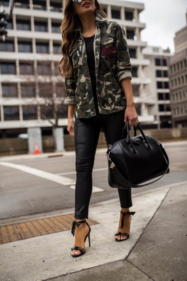 fashion blogger mia mia mine wearing a camo jacket and faux leather pants