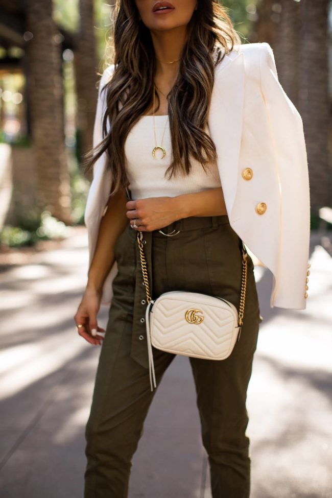 fashion blogger mia mia mine wearing olive paper bag waist pants from revolve