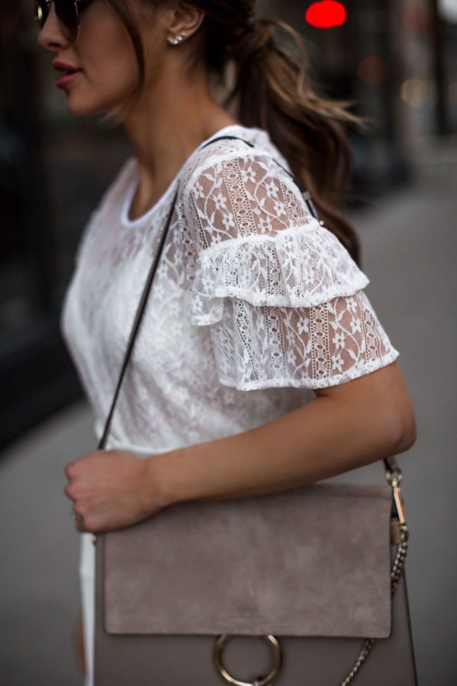 fashion blogger mia mia mine wearing a white lace bcbg top from walmart