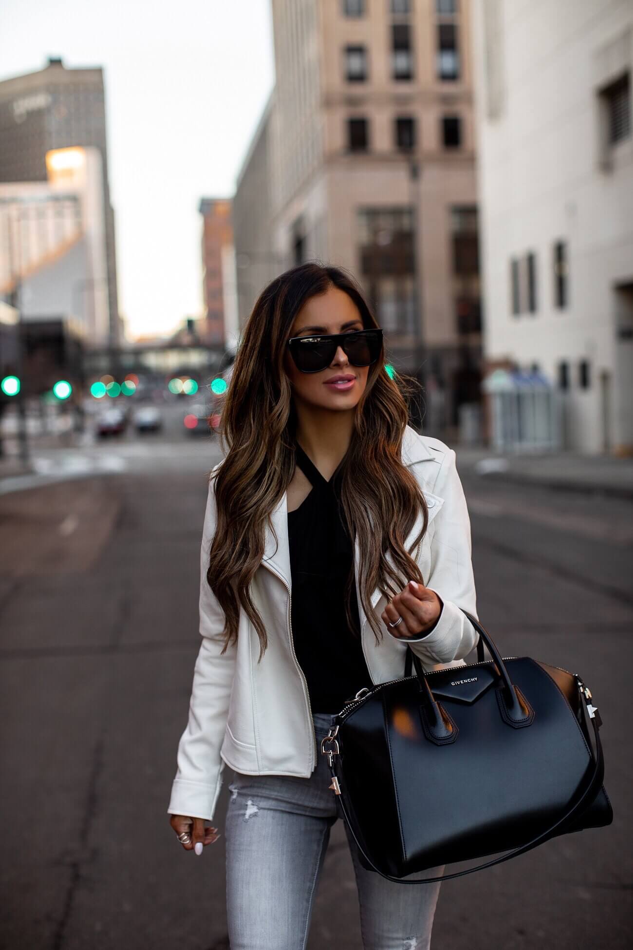 fashion blogger mia mia mine wearing a white faux leather jacket from walmart for spring