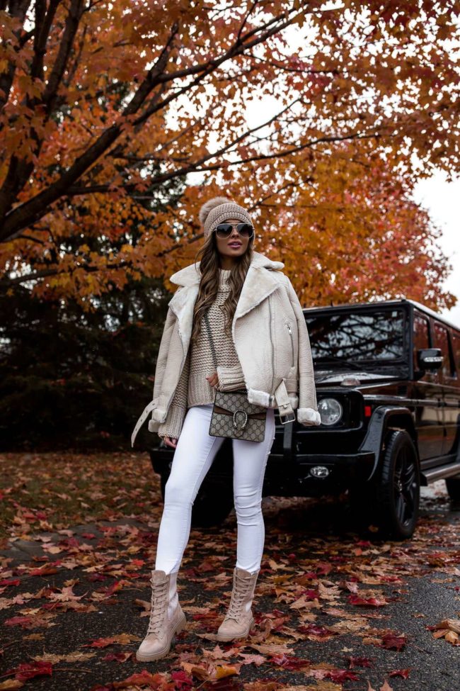 fashion blogger mia mia mine wearing a white biker jacket from nordstrom and beige combat boots