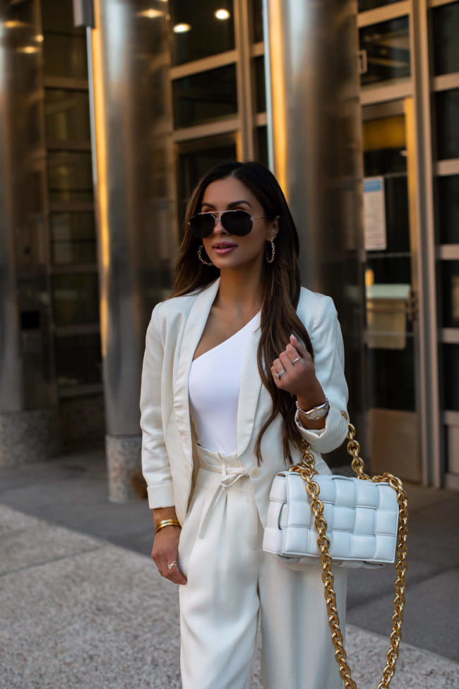 fashion blogger mia mia mine wearing a white linen blazer from express
