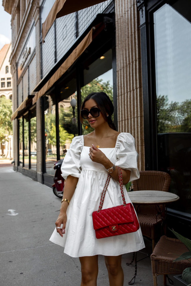 fashion blogger mia mia mine wearing a white scoop dress from walmart