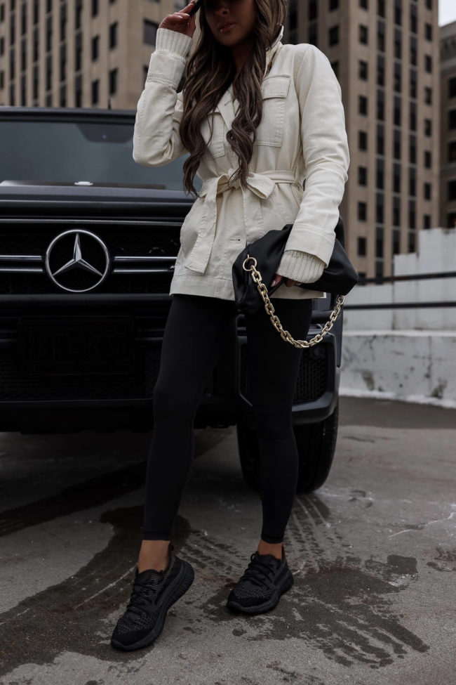 fashion blogger wearing black leggings from walmart's free assembly line