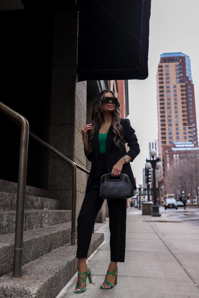 fashion blogger wearing an express black suit for spring