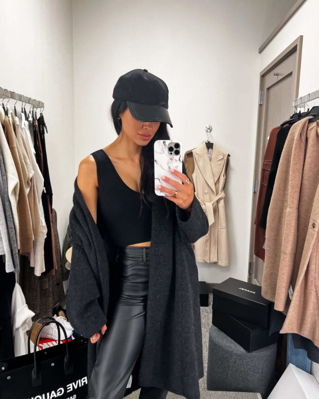 fashion blogger mia mia mine wearing a black crop top from the nsale 2022