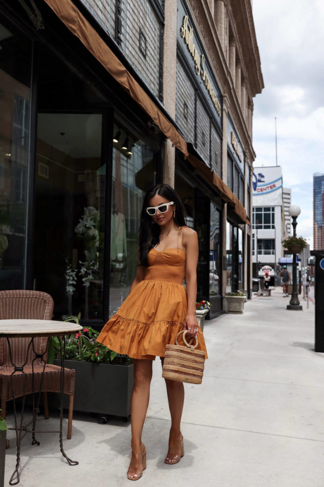 fashion blogger wearing a bustier dress from saks
