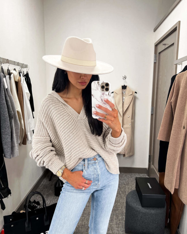 fashion blogger mia mia mine wearing a free people pullover from the nsale 2022