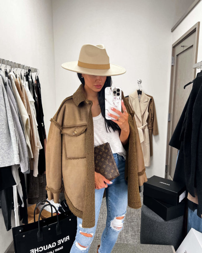 fashion blogger mia mia mine wearing a sherpa shacket by good american from the nsale 2022