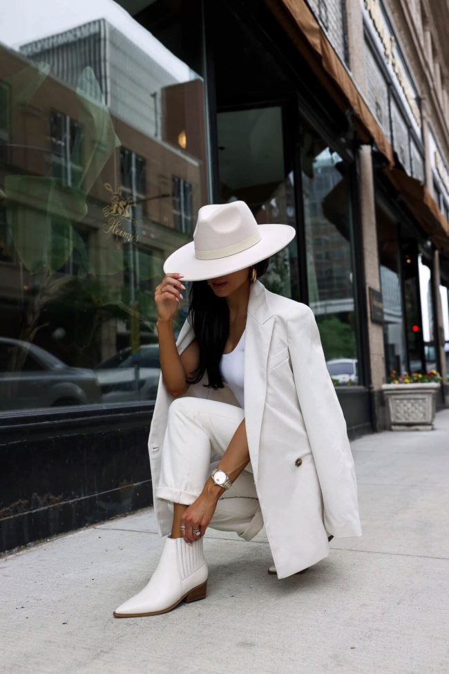 fashion blogger wearing marc fisher white booties from the nsale 2022