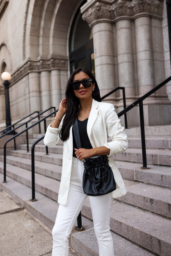fashion blogger mia mia mine wearing a black bodysuit and white linen blazer from walmart