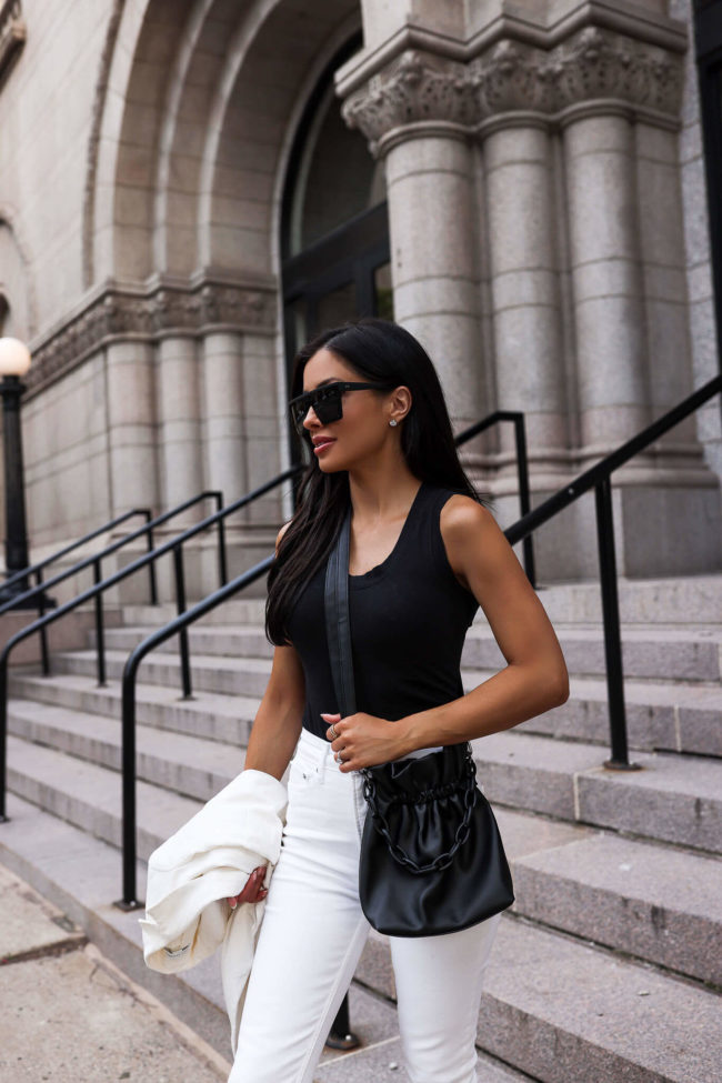 fashion blogger mia mia mine wearing a black bodysuit from walmart