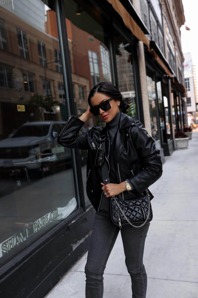 fashion blogger mia mia mine wearing a faux leather jacket from walmart