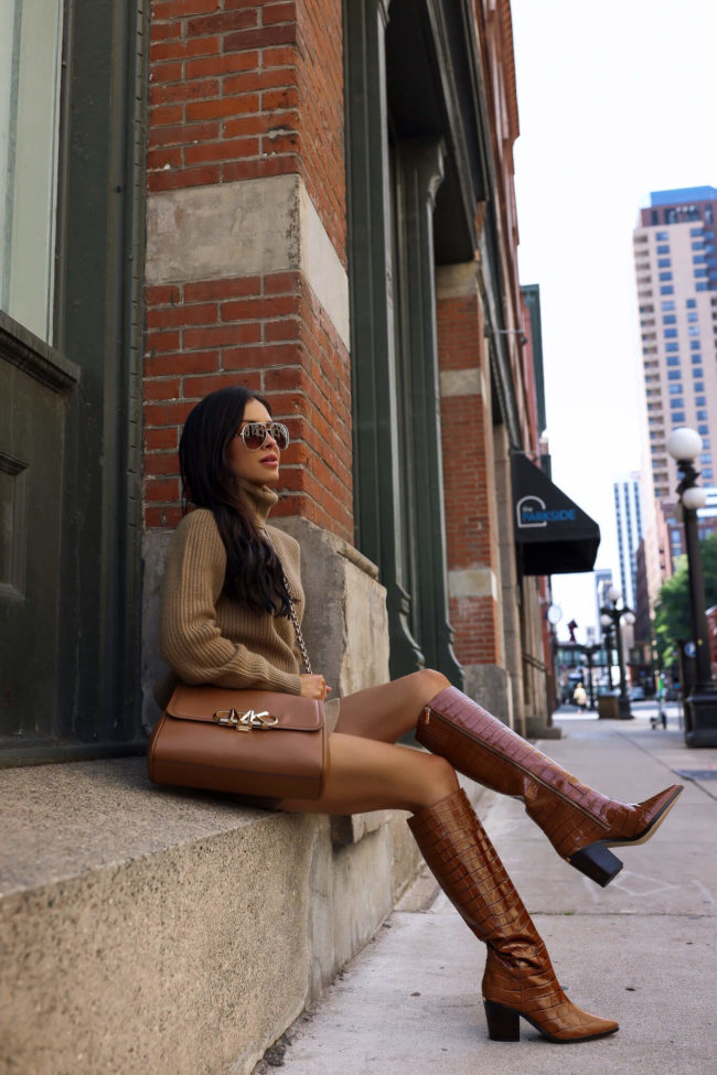 fashion blogger mia mia mine wearing brown croc boots from michael kors