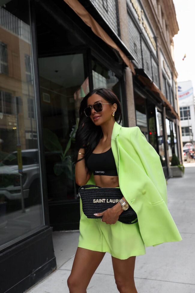 fashion blogger carrying black saint laurent raffia bag