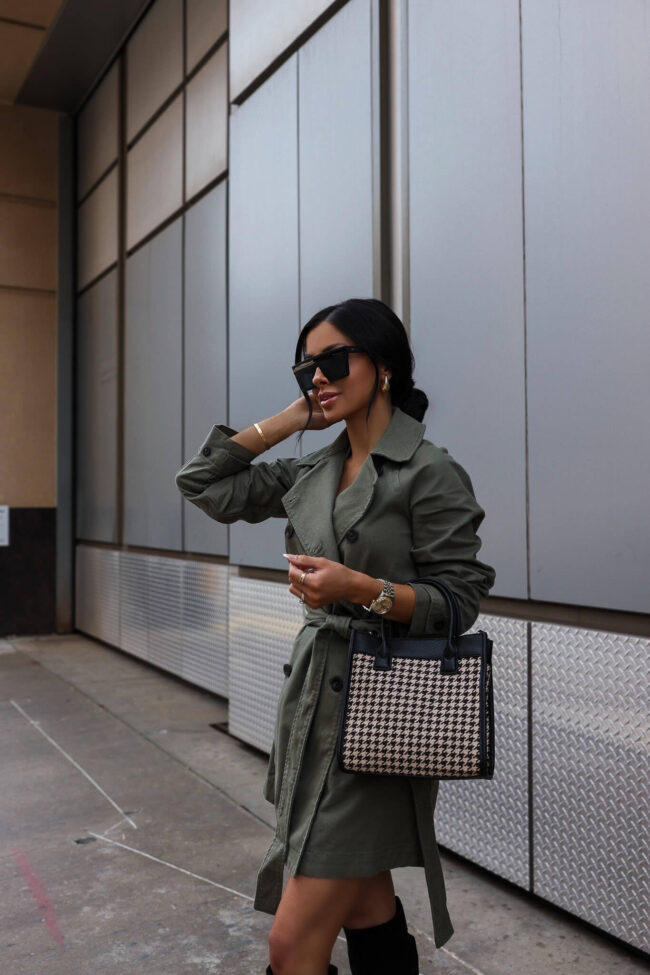 fashion blogger mia mia mine wearing a houndstooth bag and a trench coat from walmart
