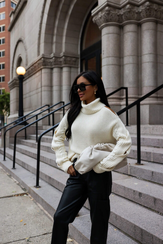 fashion blogger mia mia mine wearing a white chunky knit sweater by sofia vergara from walmart