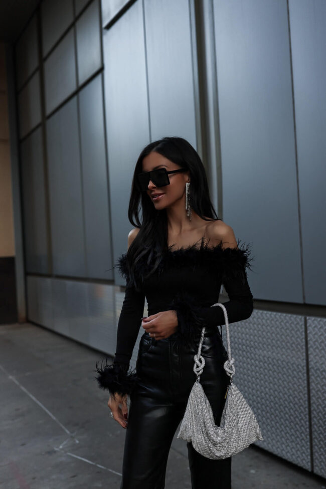 fashion blogger mia mia mine wearing a feather off the shoulder bodysuit from nordstrom