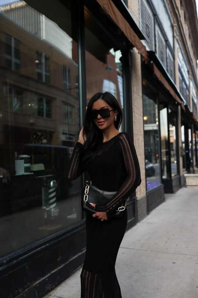 fashion blogger wearing a black knit dress from walmart
