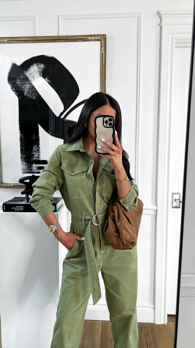 fashion blogger wearing a green jumpsuit from walmart