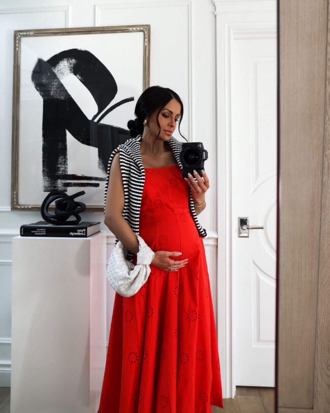 fashion blogger wearing a red eyelet dress from walmart