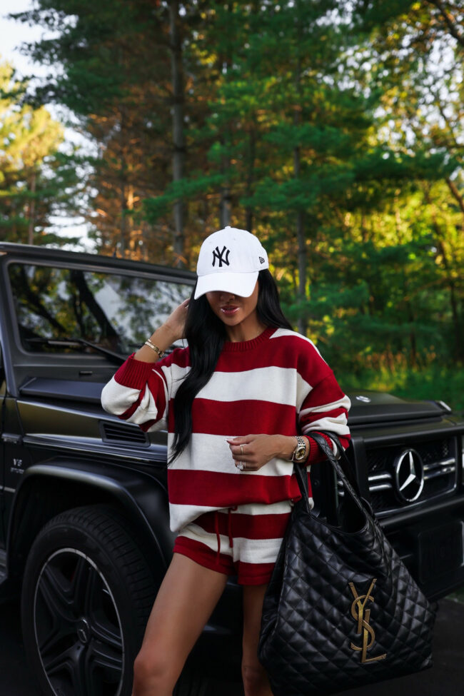 fashion blogger wearing a red striped pullover sweater and red striped shorts from nordstrom