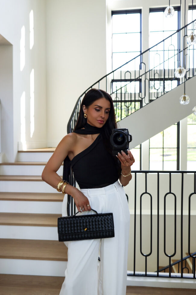 brunette fashion blogger wearing an amazon braided clutch