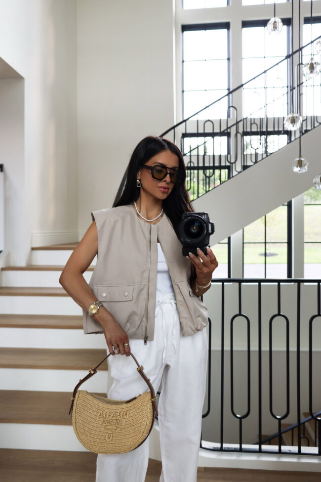 mia mia mine wearing a beige vest from amazon