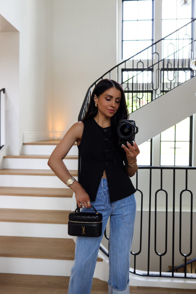 fashion blogger wearing a black vest from the nordstrom anniversary sale