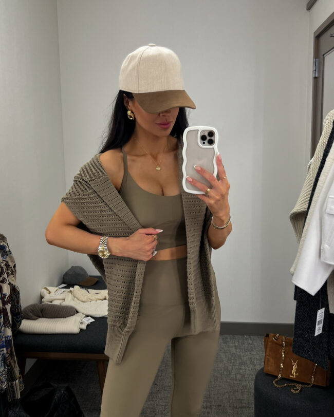 fashion blogger wearing a green open knit pullover from varley