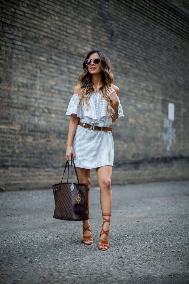 fashion blogger mia mia mine wearing a striped off-the-shoulder dress from nordstrom and lace-up heels from sole society