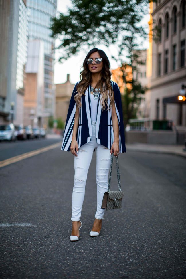 fashion blogger mia mia mine wearing a stripe blazer