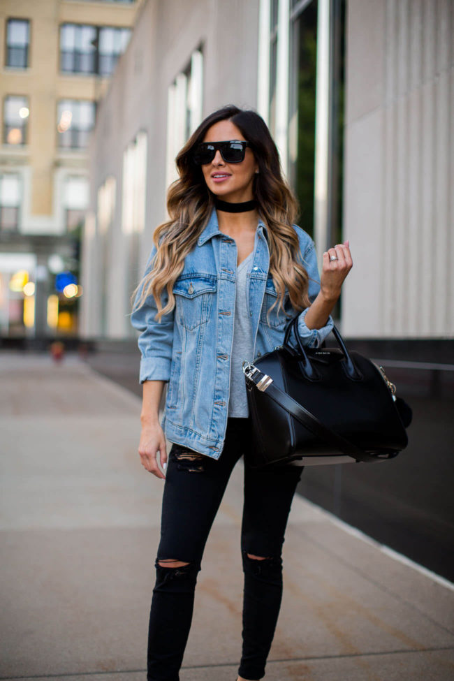 fashion blogger mia mia mine in a denim jacket and black ripped jeans by topshop