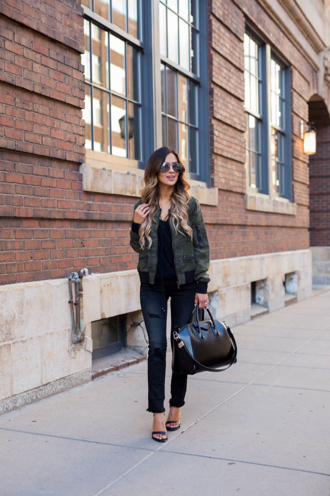 fashion blogger mia mia mine wearing a sanctuary camouflage jacket from nordstrom and black jeans
