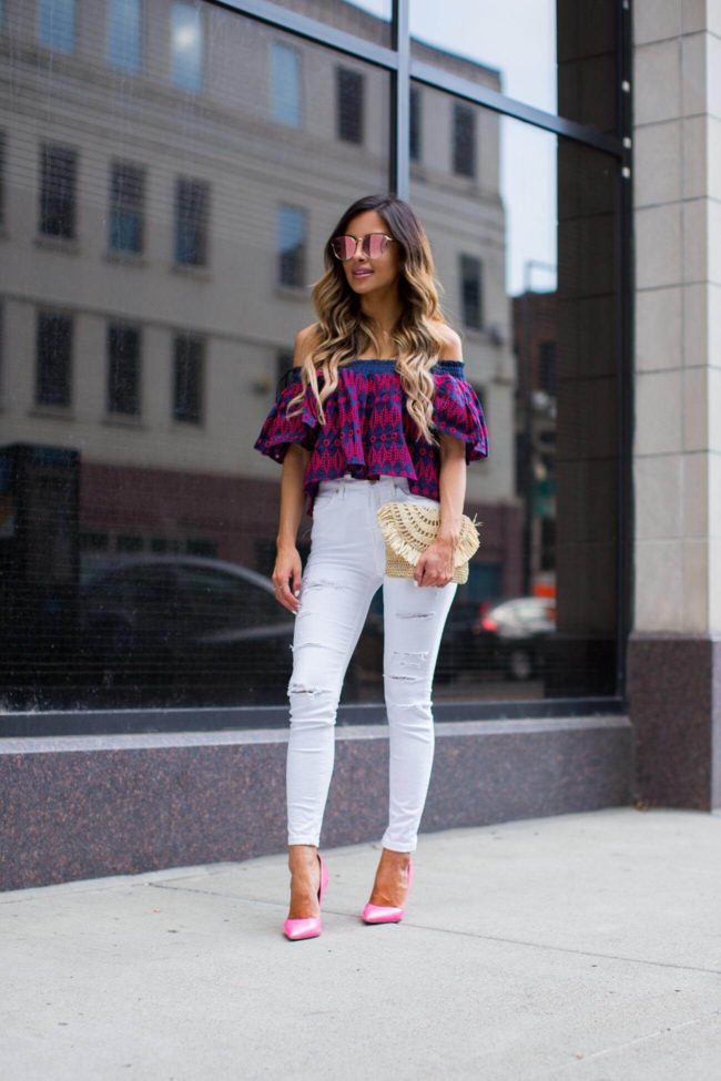 fashion blogger mia mia mine in a pink crop top and white jeans from shopbop