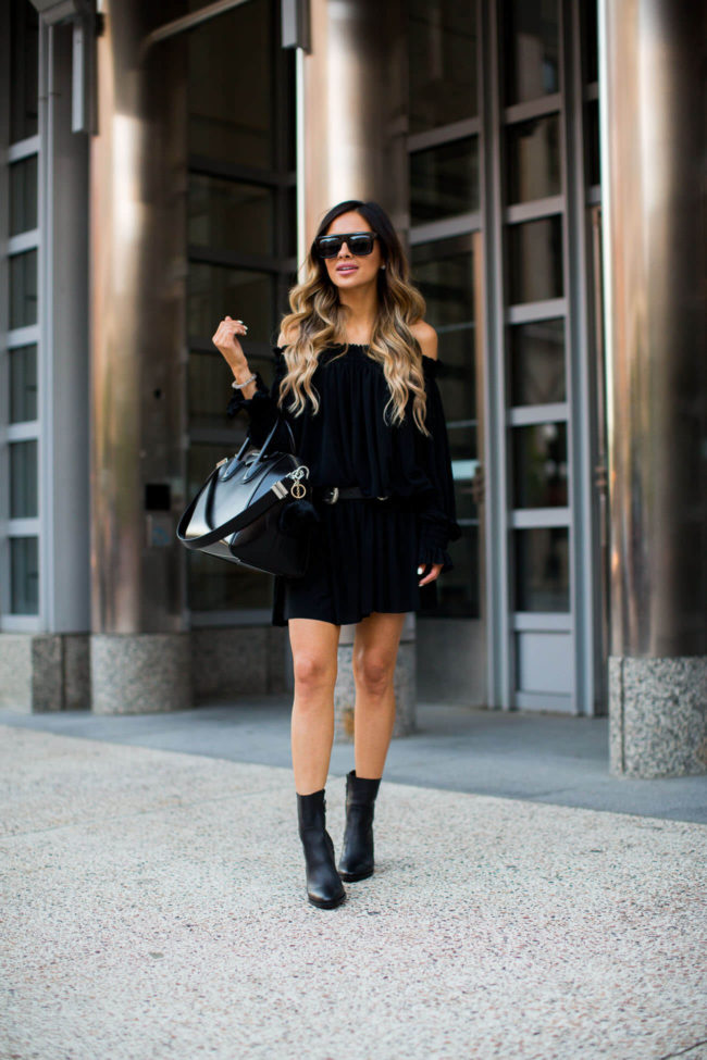 fashion blogger mia mia mine wearing a black off-the-shoulder peasant dress by norma kamali