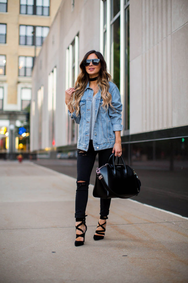 fashion blogger mia mia mine wearing a topshop denim jacket and black ripped jeans