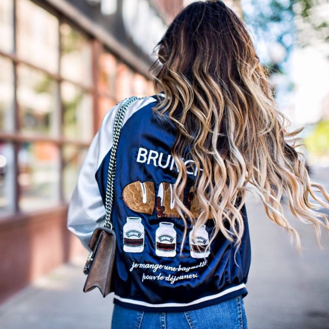 mia mia mine wearing a brunch bomber jacket