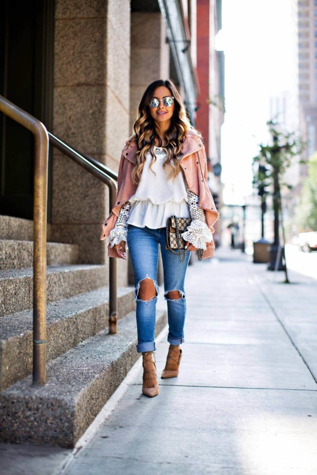 fashion blogger mia mia mine in a white lace off-the-shoulder top from shopbop, levi's jeans and a pink moto jacket from nordstrom 
