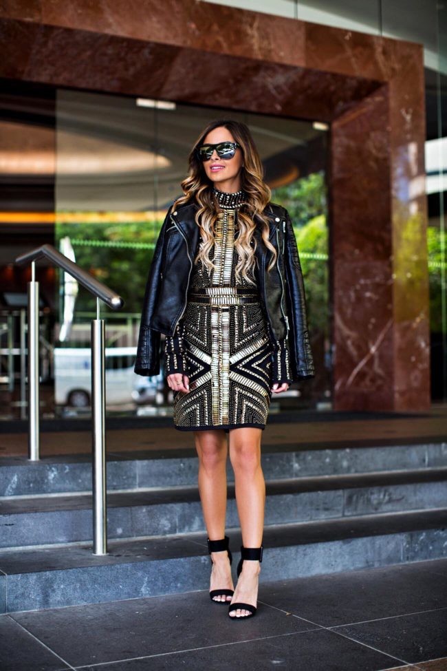 Fashion blogger Mia Mia Mine wearing a sequin dress from missguided's peace + love collection