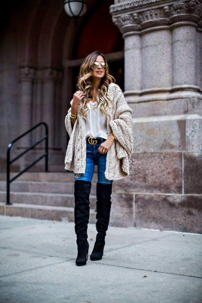 fashion blogger mia mia mine in a cable knit wrap and over-the-knee boots from nordstrom