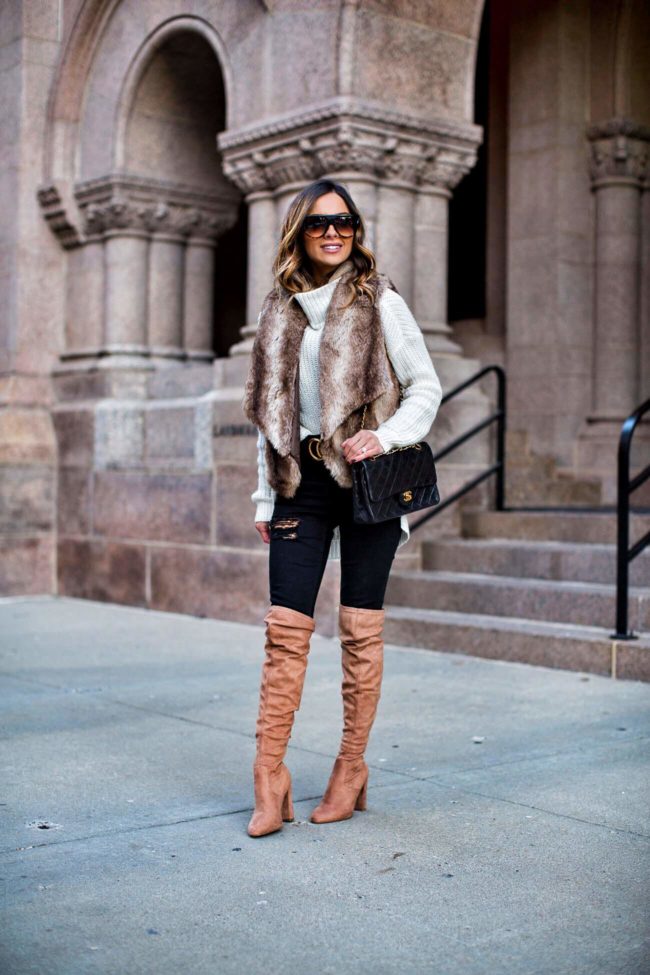 fashion blogger mia mia mine wearing a faux fur vest by bb dakota and steve madden over-the-knee boots from nordstrom