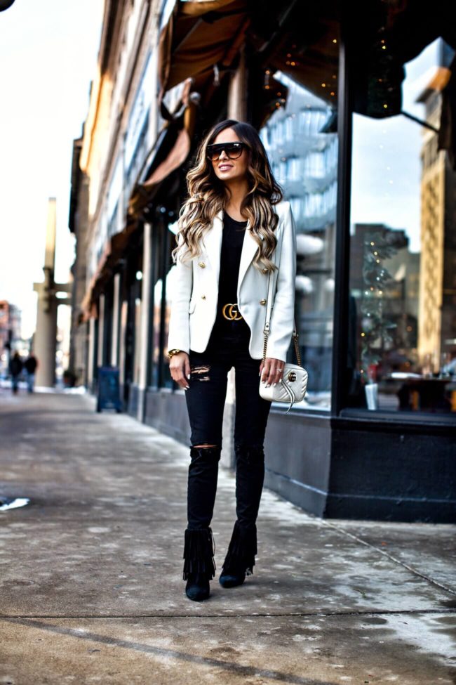 mn fashion blogger mia mia mine wearing a white lioness blazer from revolve and celine flat top sunglasses