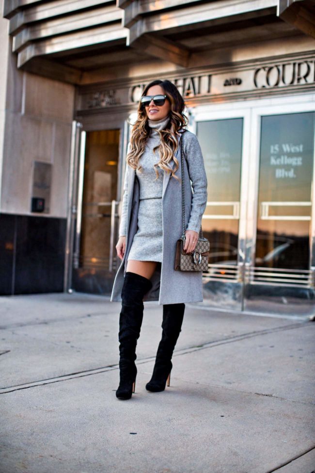 fashion blogger mia mia mine wearing a gray sweater dress from asos and a gray sleeveless trench from nordstrom