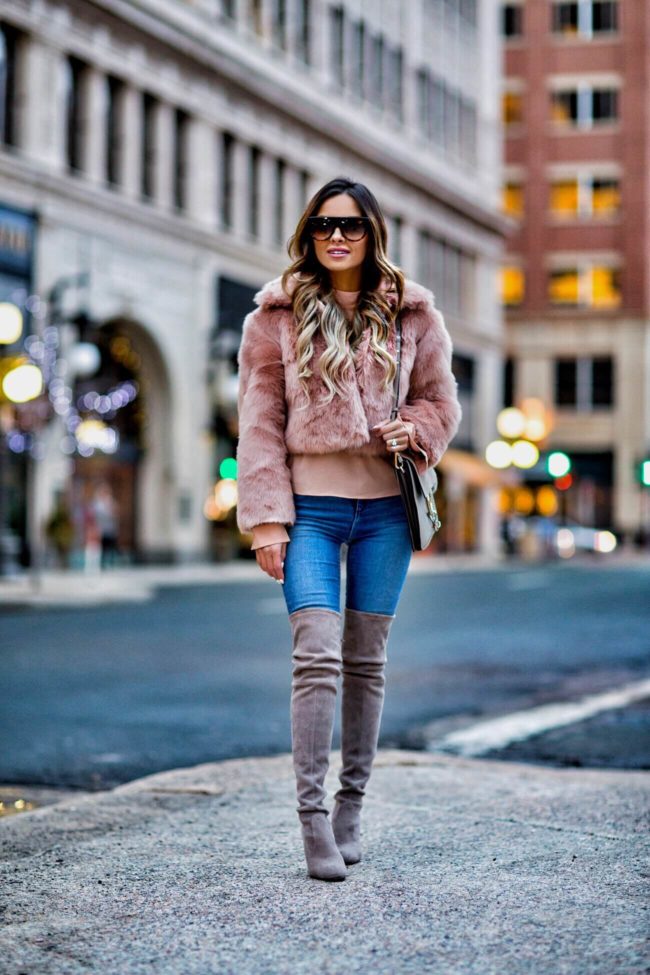 fashion blogger mia mia mine wearing a blush faux fur jacket and a chloe faye medium bag