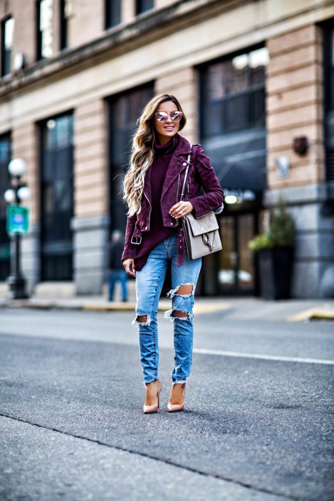 fashion blogger mia mia mine wearing a suede jacket from nordstrom and ripped jeans from revolve
