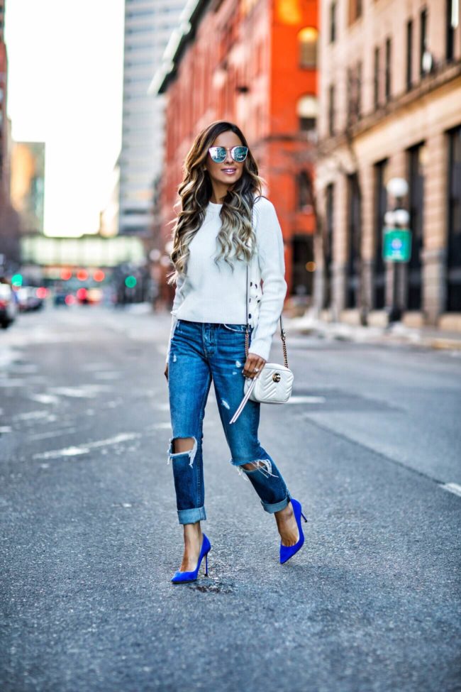 Fashion blogger mia mia mine wearing grlfrnd jeans and a gucci marmont bag